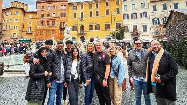 in front of the fountain of Neptune