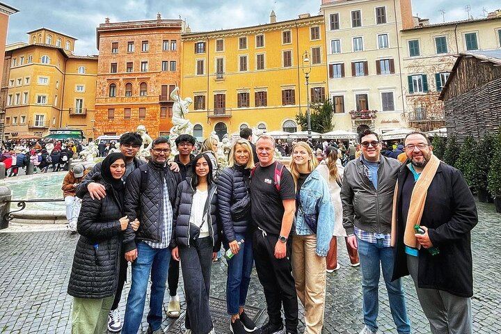 in front of the fountain of Neptune