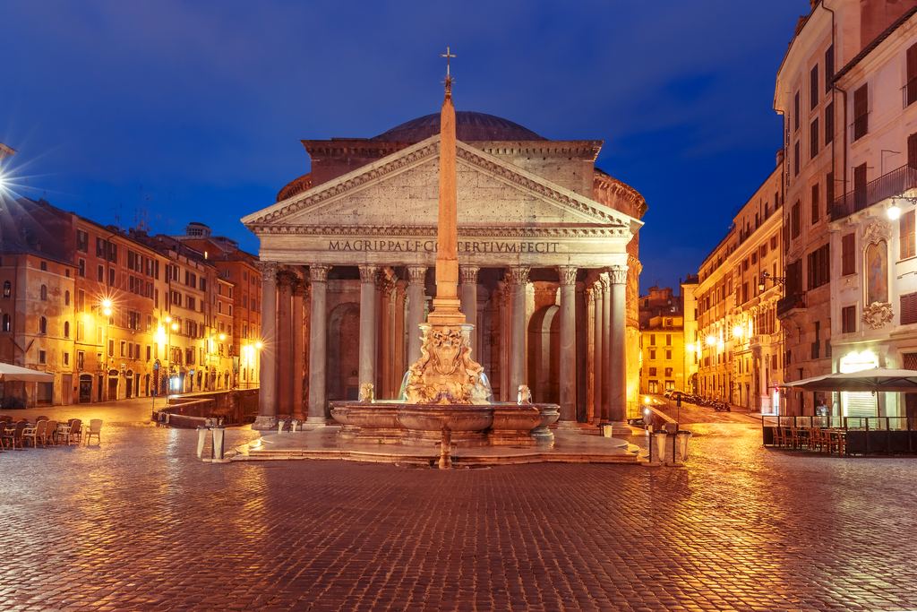 The fountain and Egyptian obelisk of Piazza della Rotonda lined up with the Pantheon's portico at blue hour