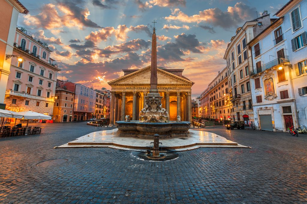 Piazza della Rotonda at sunset, the obelisk and fountain in the centre under a pink and violet sky