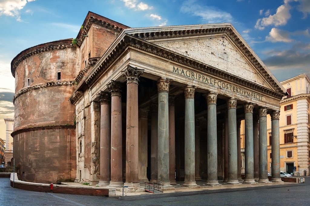 The Pantheon from an angle, showing the brick drum of the rotunda behind the columned portico