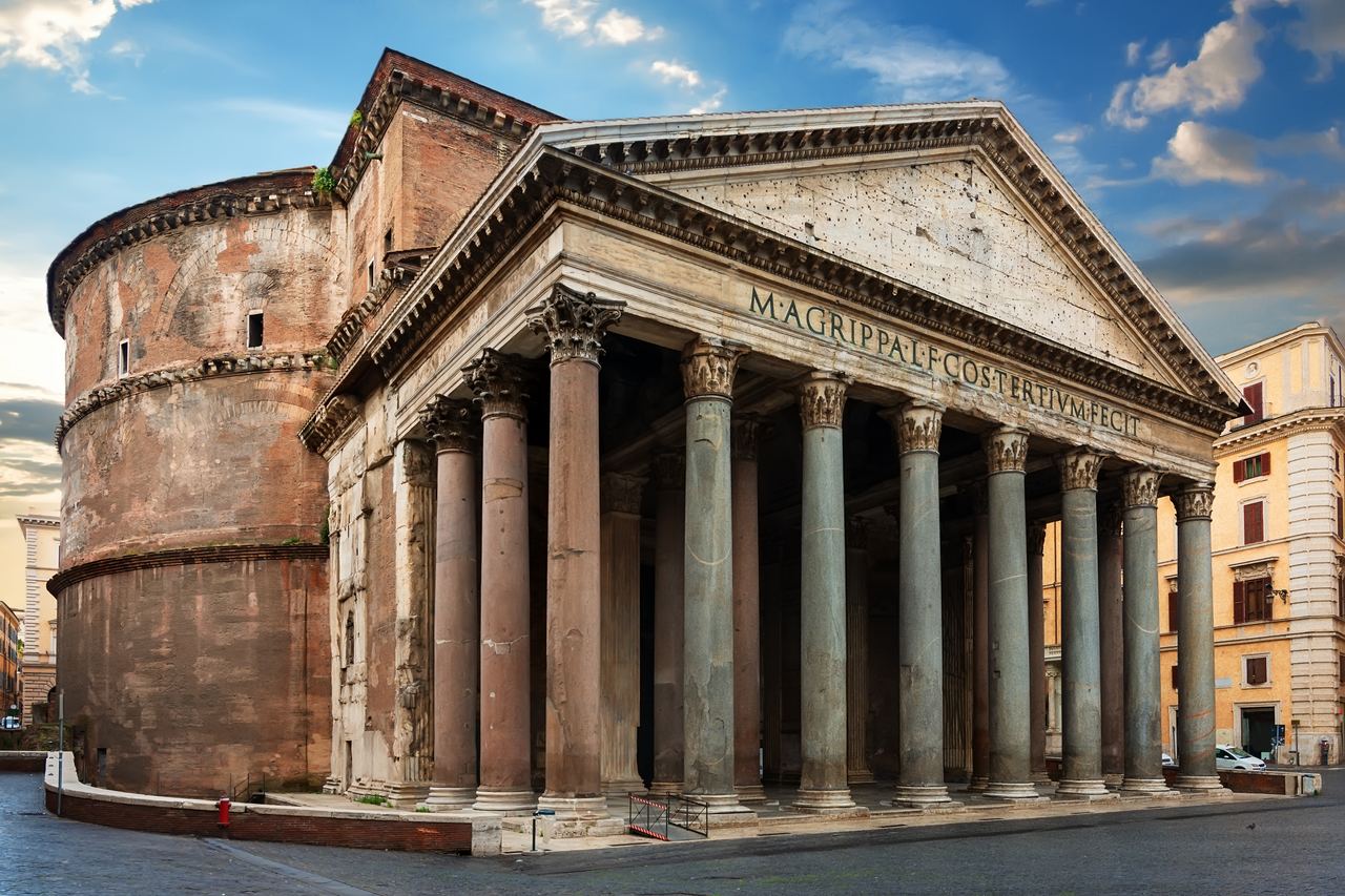 The Pantheon from an angle, showing the brick drum of the rotunda behind the columned portico