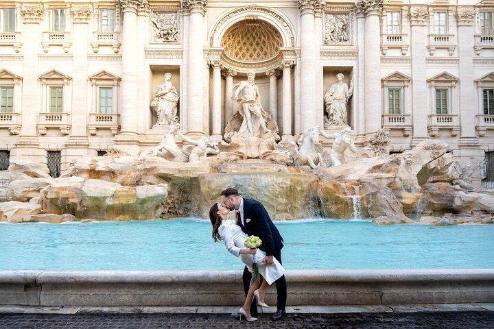 Romantic couple photoshoot at Trevi Fountain in Rome, creating cinematic and unforgettable honeymoon memories.
