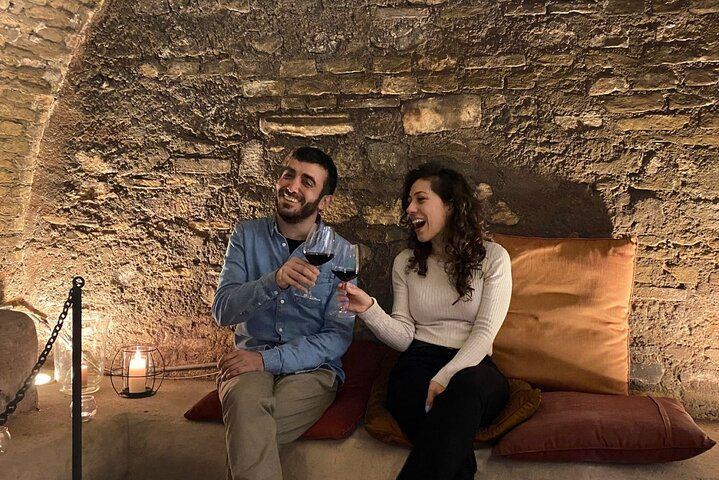Sitting in the ancient Roman ruins with wine