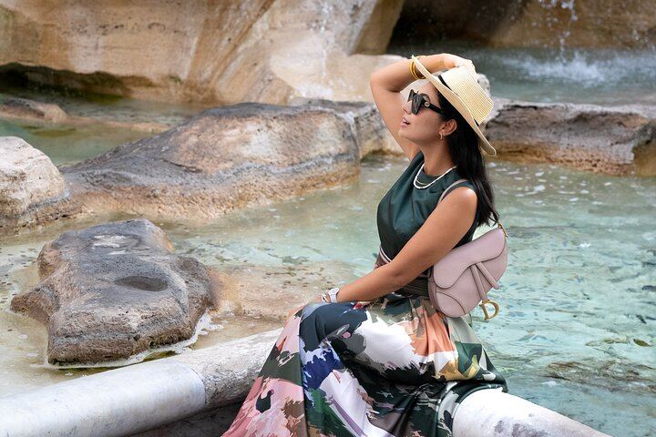 Solo traveler photoshoot at Trevi Fountain in Rome, capturing elegant and stylish moments during your vacation.