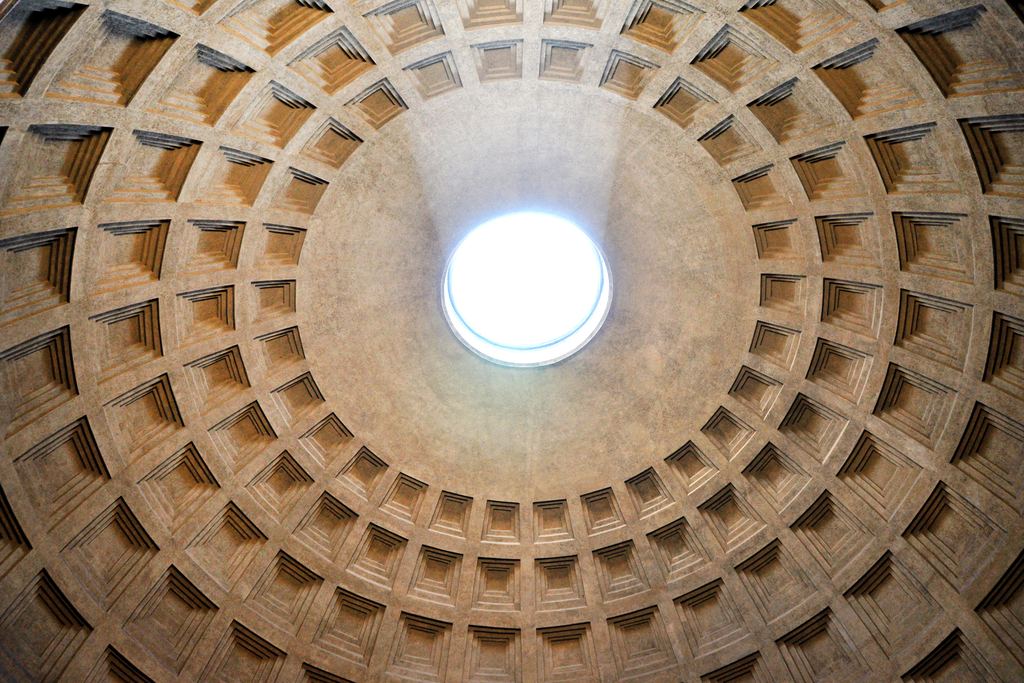 Looking straight up into the Pantheon dome in Rome: five concentric rings of sunken coffers narrowing towards the oculus