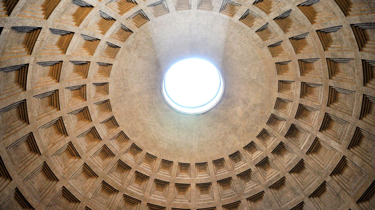 Looking straight up into the Pantheon dome in Rome: five concentric rings of sunken coffers narrowing towards the oculus