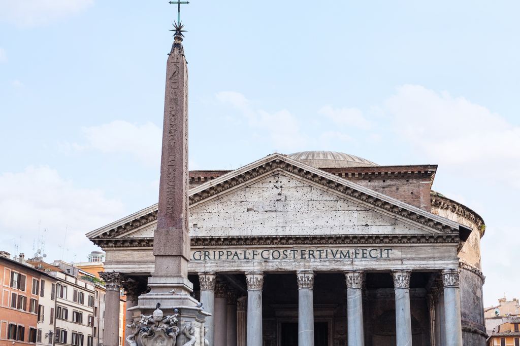 The Macuteo obelisk on the fountain in Piazza della Rotonda standing directly in front of the Pantheon's pediment