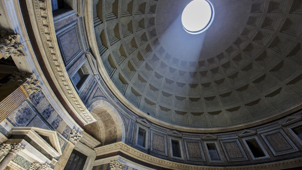 The open oculus of the Pantheon in Rome seen from the floor, ringed by five rows of coffers