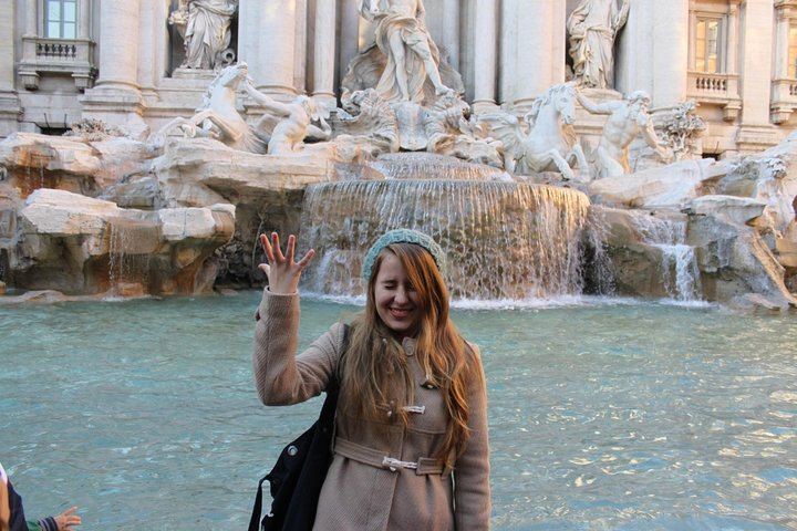 Throw a coin in the Trevi Fountain